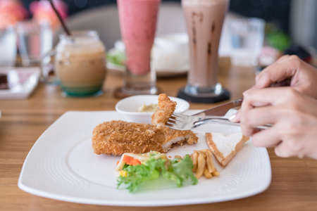 eating steak on wood table with Beverages backgroundの写真素材