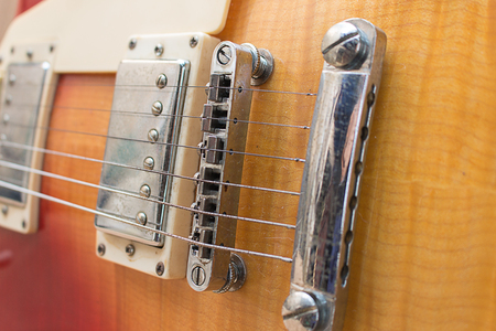 Bridge electric guitar strings wood audio metallicの写真素材