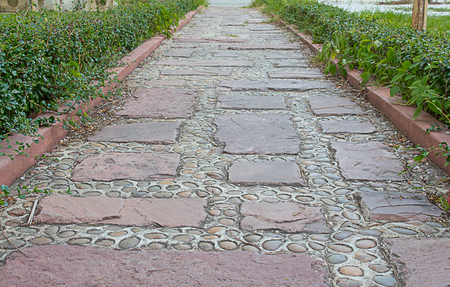 stone walkway through the gardenの写真素材