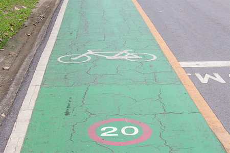 Bike lane signs painted onto a green bike lane ( Bike lane, road for bicycles )の写真素材