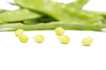 fresh green peas, sugar Pea, Sweet peas, Garden Pea, snow peas, seed peas, Pea pale on white background, and Blur blurred the background. select focus front nuts.の写真素材
