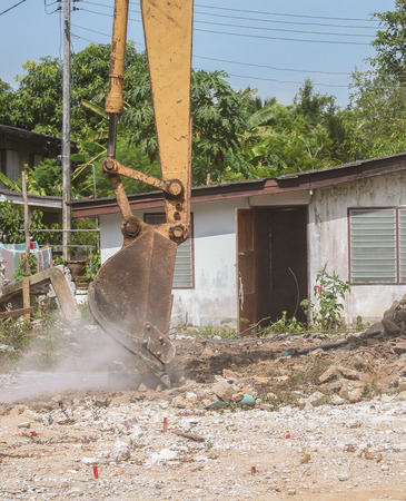 bucket Excavator. excavator destruction in Work outdoor  construction  that dust motion : select focus front bucket Excavator :の写真素材