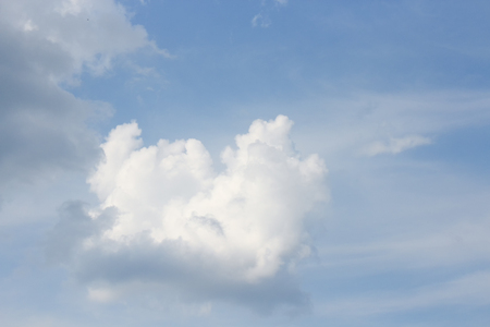 Blue sky with white clouds, and raincloud  motion. (may be used as background)の写真素材