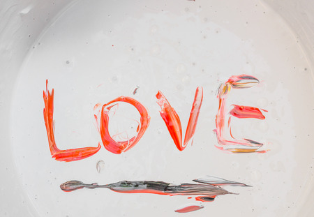 Love, Caption word love Red in the  colour surface.の写真素材