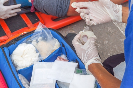 physician  open Scotch Tape, assist patient in emergency rescue situations.(select focus hand physician)の写真素材