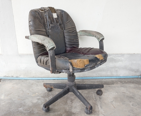 black Office chair old damage leather and dirty, time to replace the office chair.(select focus chair)の写真素材
