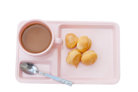 Coffee and candy custard cream, creme anglaise, whipped cream, dessert on a Pink plate  Isolated on white  background clipping pathの写真素材