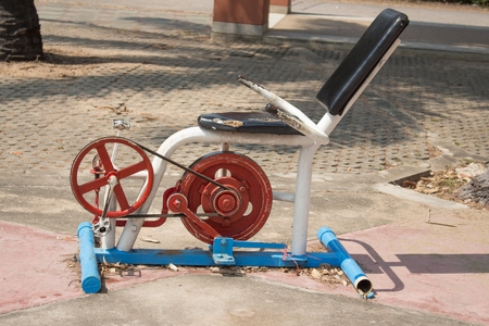 Old cycle exercise steel in the park,Fitness machine invented in the garden.