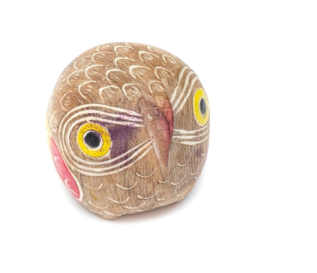 Old wooden carved Owl head, boyhood or girlhood toy on white background.の写真素材