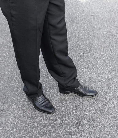 men pants and shoes. Legs of  businessmen. businessman in black trousers and shoes. Businessman standing on the floor in polished shoes.の写真素材
