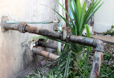 Water valve Plumbing Steel dilapidated. old rusty industrial tap water pipe. Dirty drinking water...