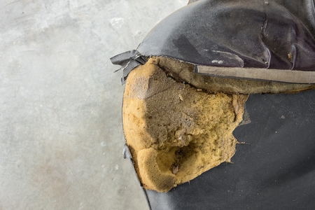 Black Office chair old damage leather and dirty, time to replace office chair.(select focus front black Office chair) :Close up,select focus with shallow depth of field.の写真素材