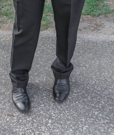 Male legs business black Shoe wear on the floor. Image businessman wearing black pants  and  black  leather shoes.の写真素材