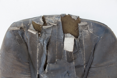 Closeup Backrest chair.  black Office chair old damage leather and dirty, time to replace the office chair on white backgroundの写真素材