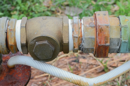 Water valve Plumbing Steel dilapidated. old rusty industrial tap water pipe. Dirty drinking water...