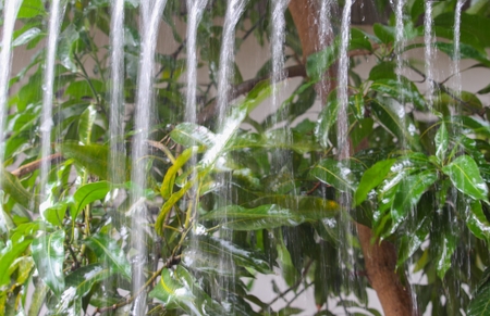 Blur blurred, Motion drop of water rain from roof at night, bokeh water reflex light . soft focus...