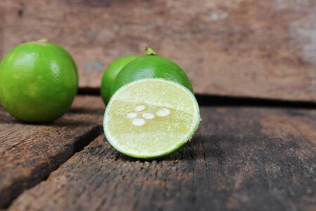 slice lemon closeup Select focus with shallow depth of field on the wooden tableの写真素材