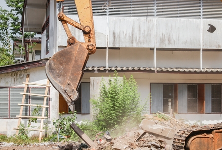 Excavator, bulldozer in work demolition construction and dust motionの写真素材