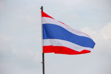 Thai flag, waving in the wind with beautiful with blue sky background.の写真素材
