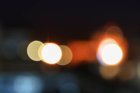 Abstract bokeh multi-color city blurred elevated night view for background with copy space for add...