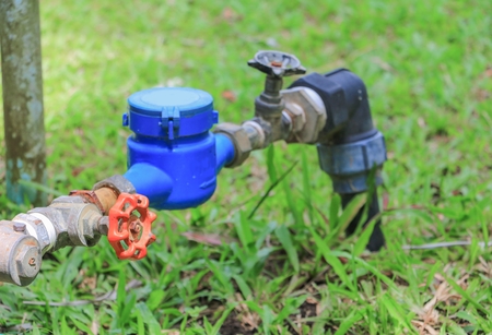 water valve  and  tap pipe  on floor grass, with copy space for add textの写真素材
