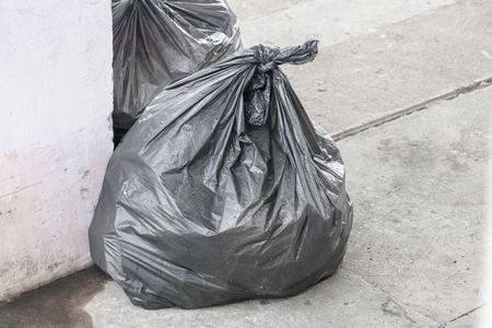 Pile of black garbage bagの写真素材