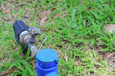 water valve  and  tap pipe  on floor grass, with copy space for add text