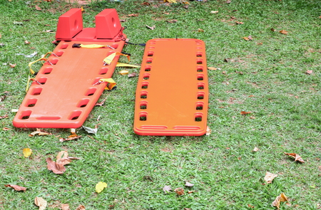 stretcher for emergency paramedic service medical equipment on green grass  backgroundの写真素材