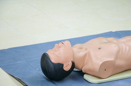 medical dummy on CPR, in emergency refresher training to assist of physician