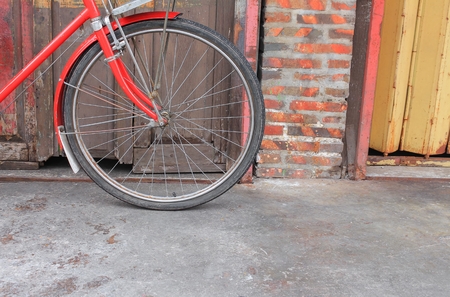 bicycle red  classic vintage in former on wall wood background with copy space for add textの写真素材