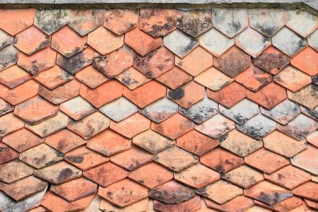 Ancient tile roof Thailand style texture, Select focus with shallow depth of field.の写真素材