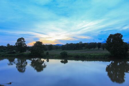 Sunset sky colorful silhouette river  time twilight  woodland nature in Thailand. The last lightの写真素材