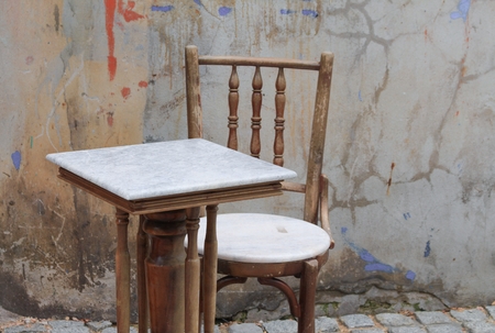 chair and table  ancient at The background is the old wallの写真素材