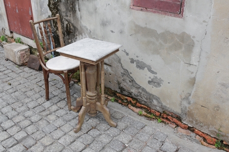 chair and table  ancient at The background is the old wall