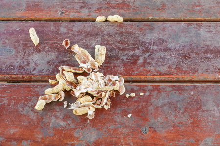 groundnut, shell nuts on a wooden table background