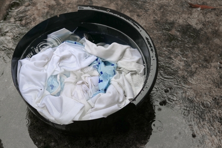 soak dirty clothes in the basin black oldの写真素材