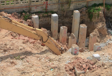 excavators work dig a hole in construction work industry at building site