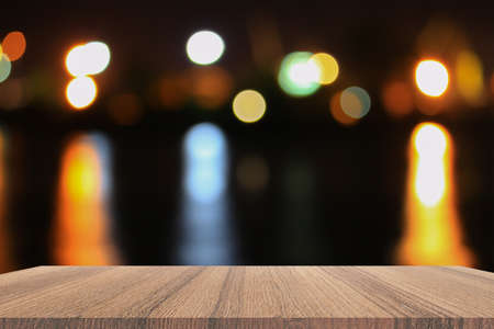 Empty wood table and night light bokeh for Christmas  New Year background. with copy space  add text