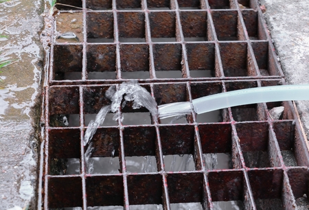 Water plumbing in rubber plastic band with flowing on ditch