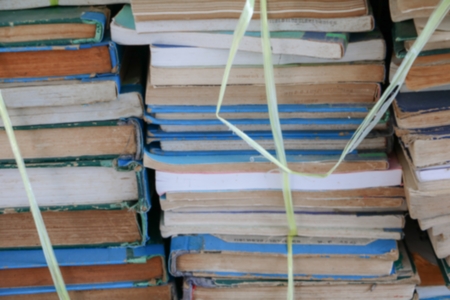 Blurred focus with  Stack of Used Old Books in the School Libraryの写真素材