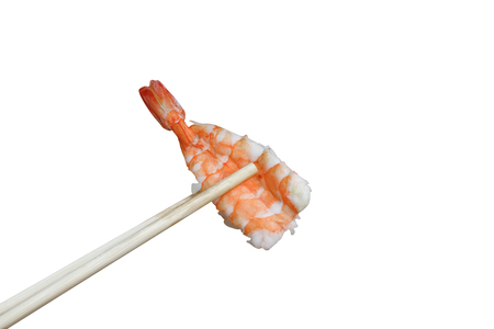 Sushi shrimp close up using of chopsticks isolated on white background, and clipping pathの写真素材