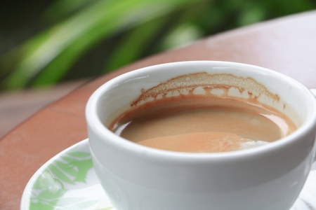 coffee cappuccino on the wood floor backgroundの写真素材