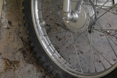Close up wheel flat tire of the motorcycle old and crackedの写真素材