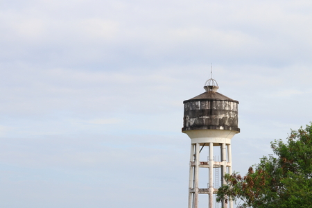 water tank ancient for agriculture on  sky backgroundの写真素材