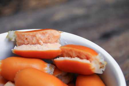 sausages boiled macro focus in white bowl on the wooden background.の写真素材