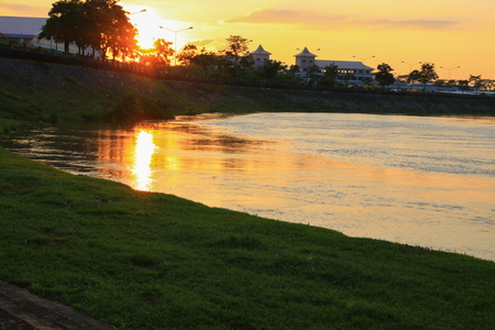 sunset in sky beautiful colorful landscape  silhouette tree woodland and river reflect  the twilight timeの写真素材