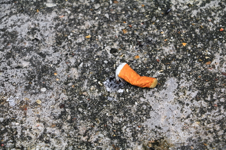 cigarette butt. on the cement floor Smoking bad for  health. concept  Non-smoking day universalの写真素材