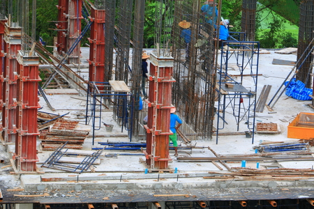 Worker construction team working on high ground building commercial in site workplace with sunrise...
