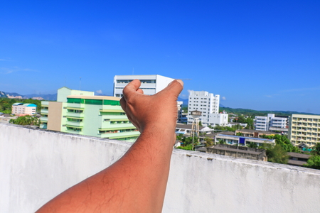 hand reach up blue sky backgroundの写真素材