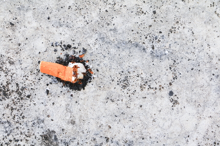 cigarette butt. on the cement floor Smoking bad for health. concept Non-smoking day universalの写真素材
